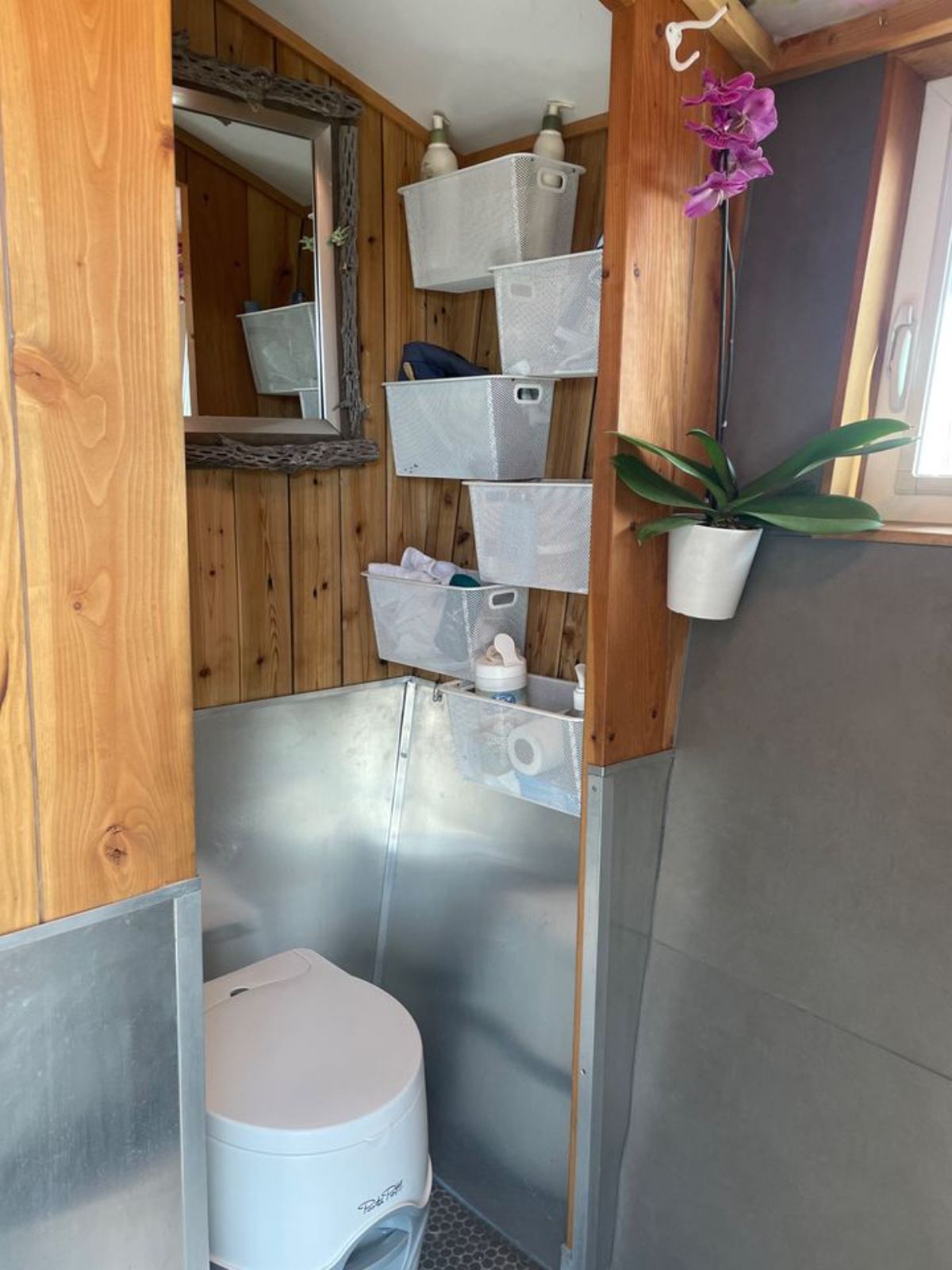bathroom and toilet with ample shelves for storage