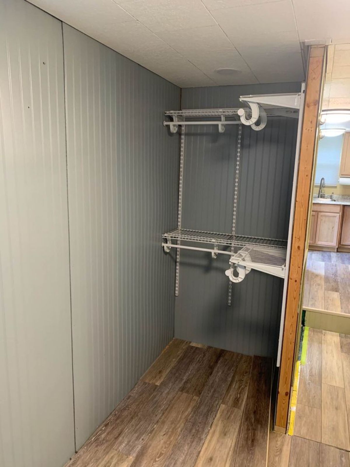 closet with wire racks against gray walls