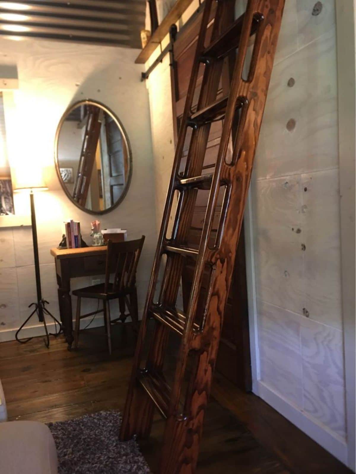 wood ladder leaning against wall