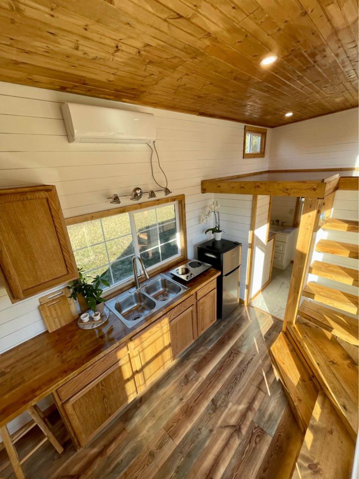 wooden interiors of a 24' tiny home on wheels