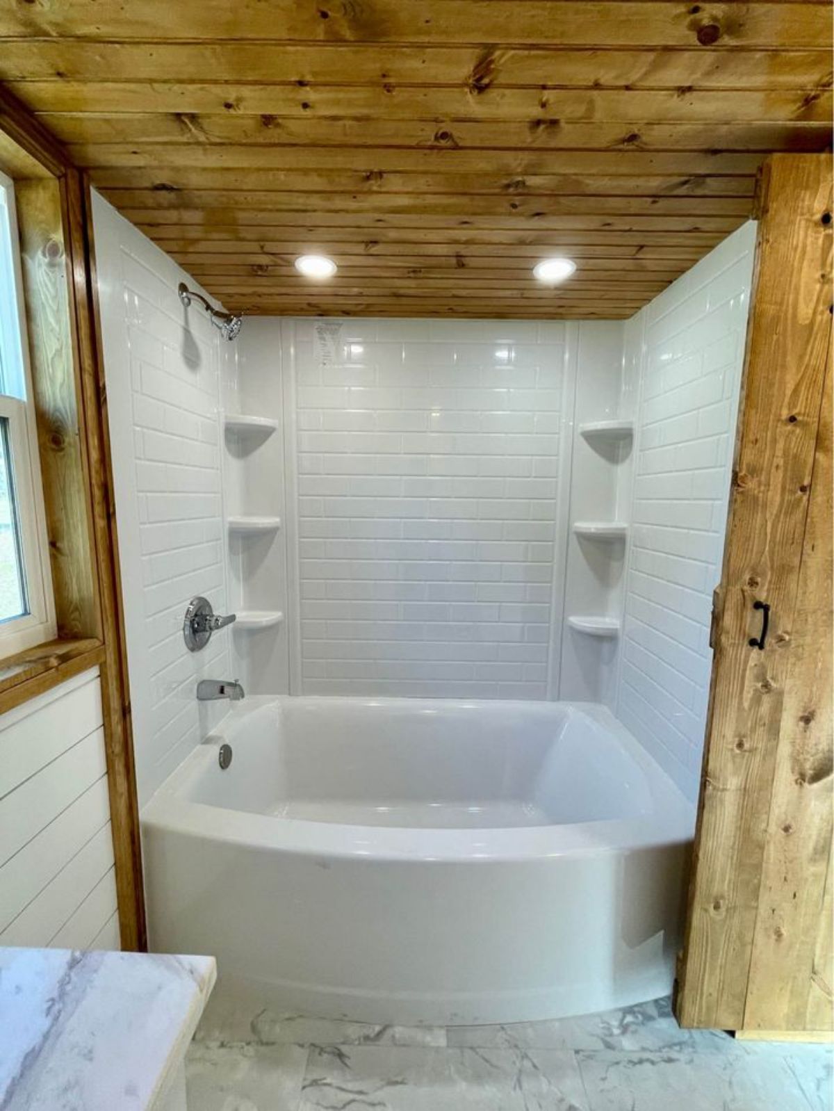 bathroom with bathtub in a house on wheels