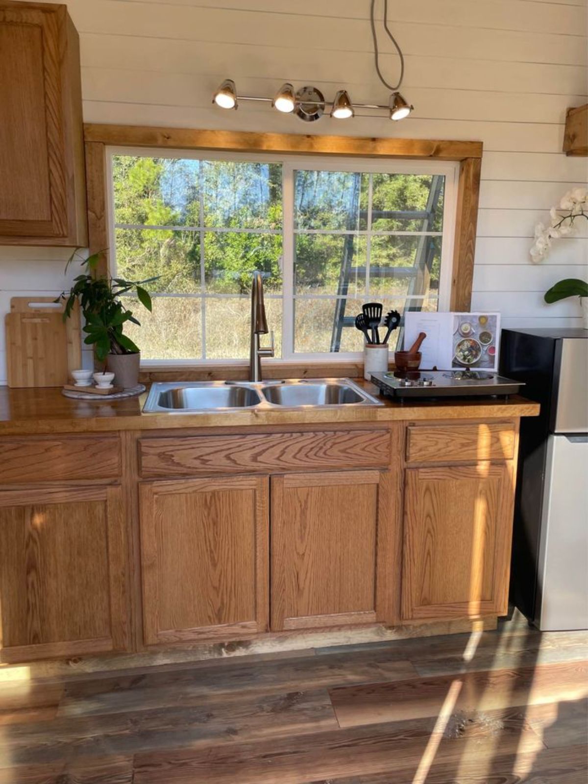 wooden interiors of a kitchen in a tiny home