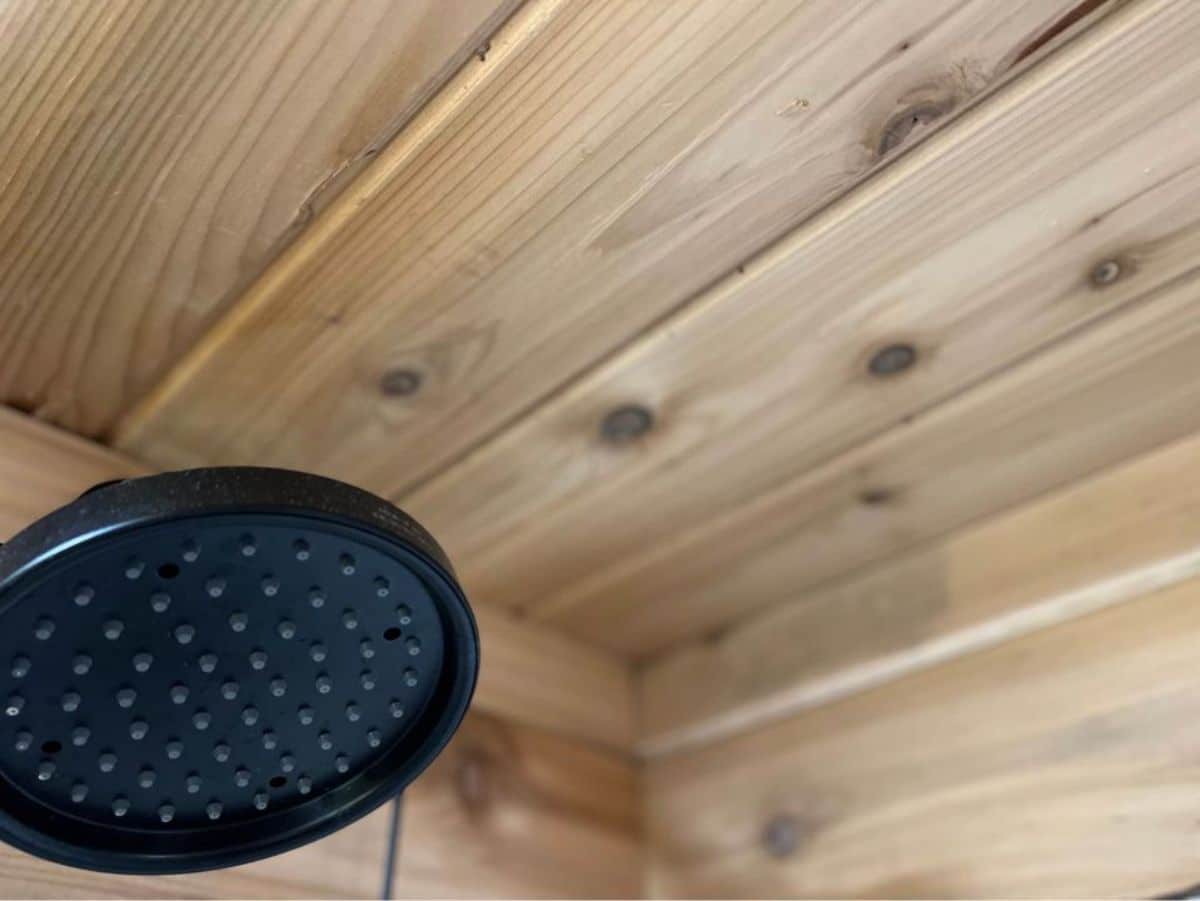 an overhead shower at tiny house on wheels