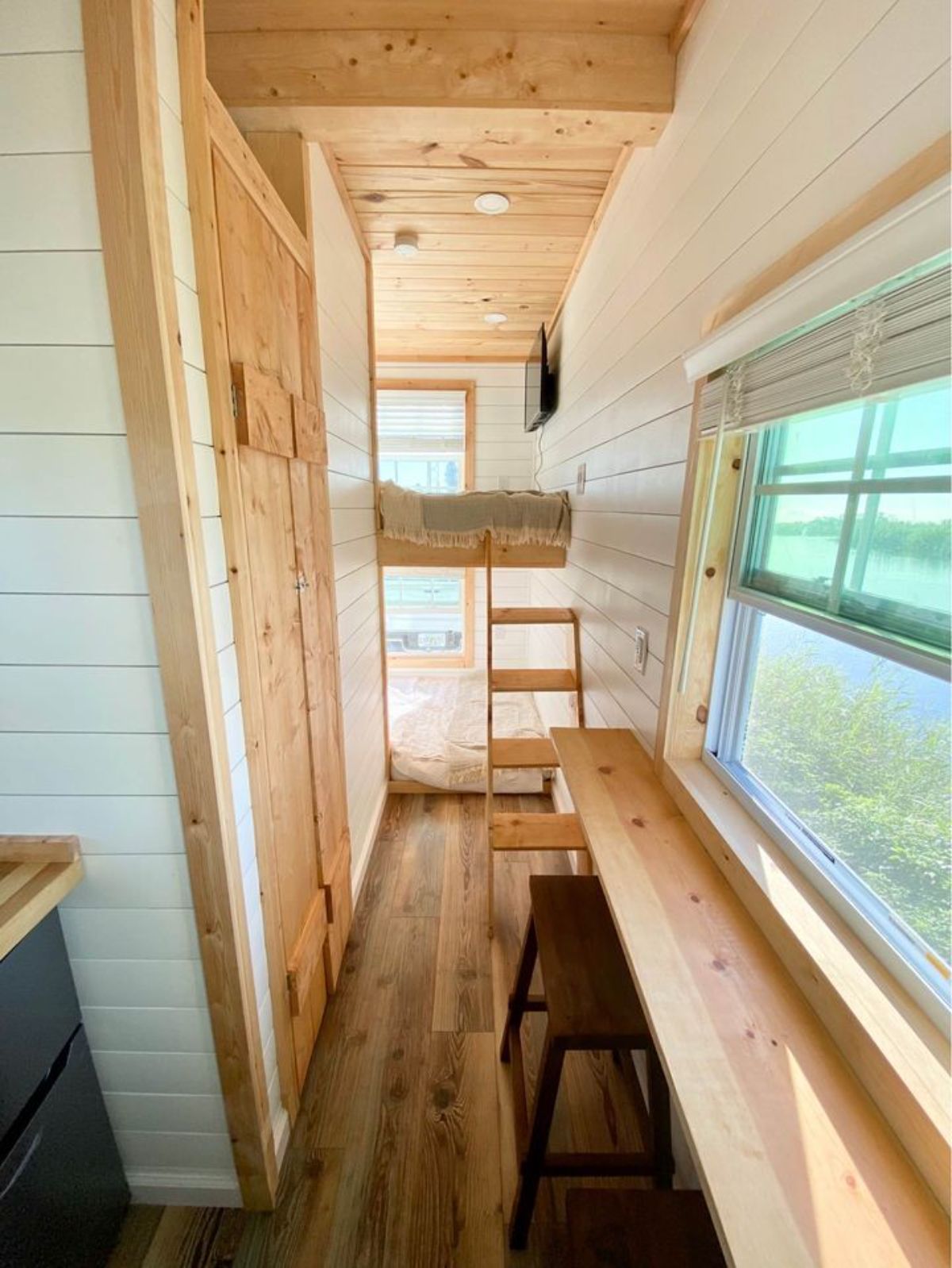 Long view of 14' Tiny Camper on Wheels from inside