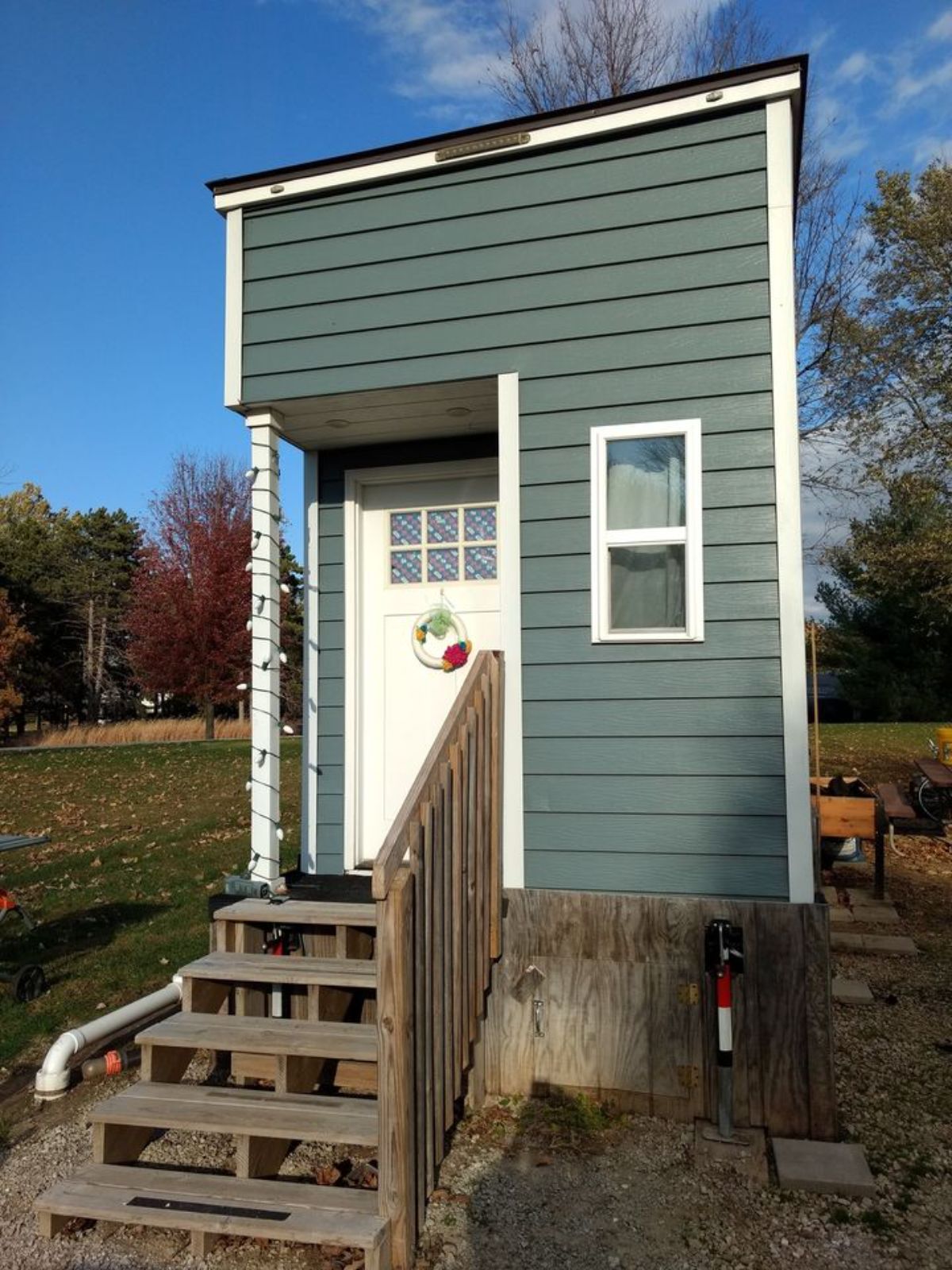 Front door view of 196 sf Tiny House on Wheels