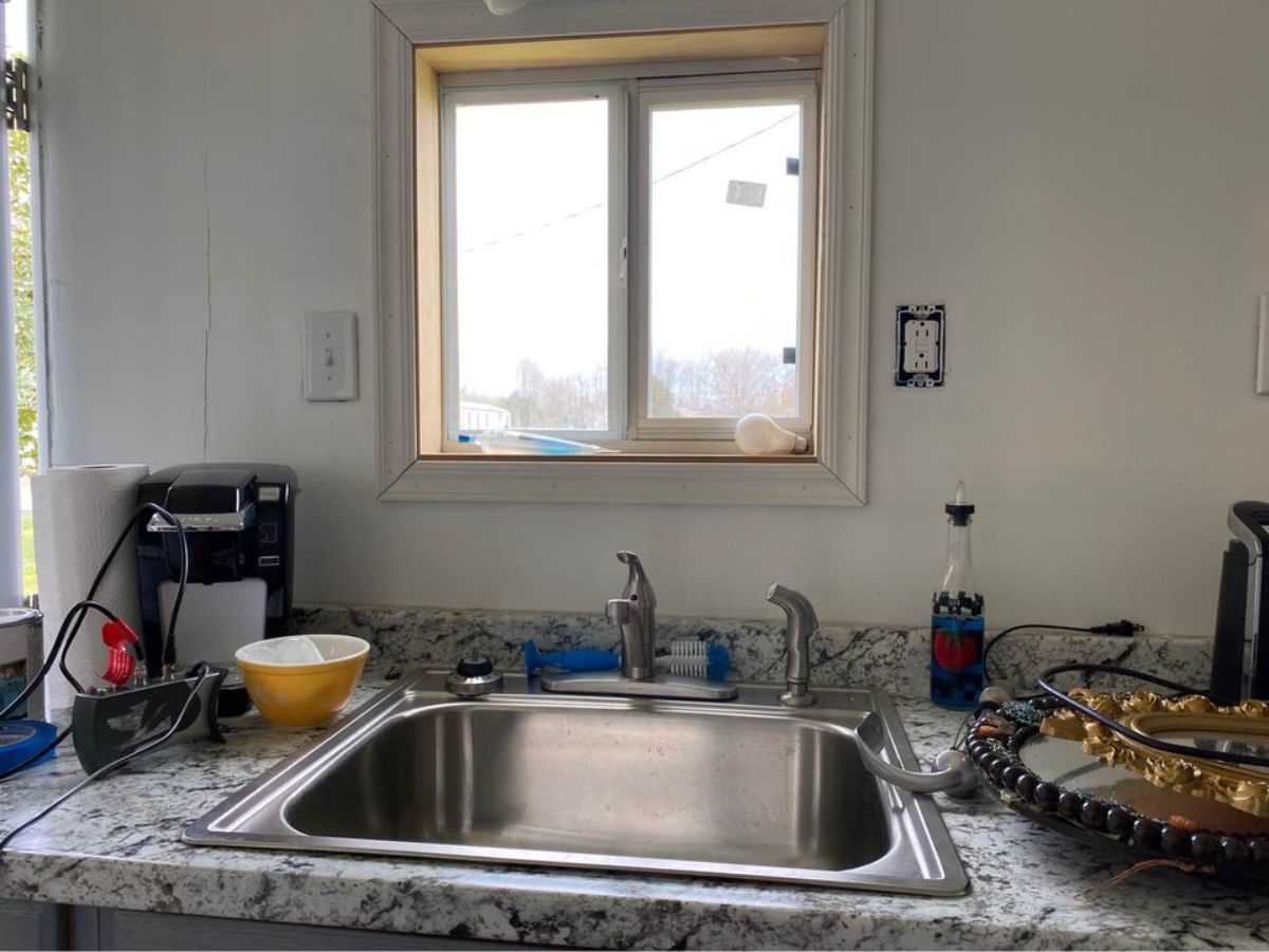 Kitchen of 20’ Tiny House on Trailer has a sink