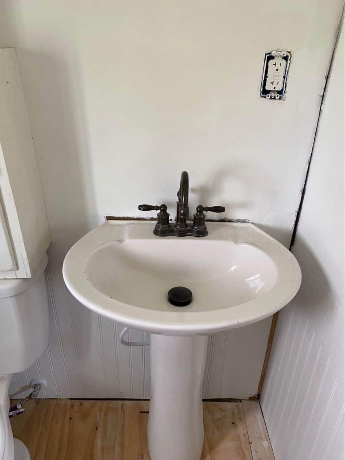 Bathroom of 20’ Tiny House on Trailer has a sink and toilet