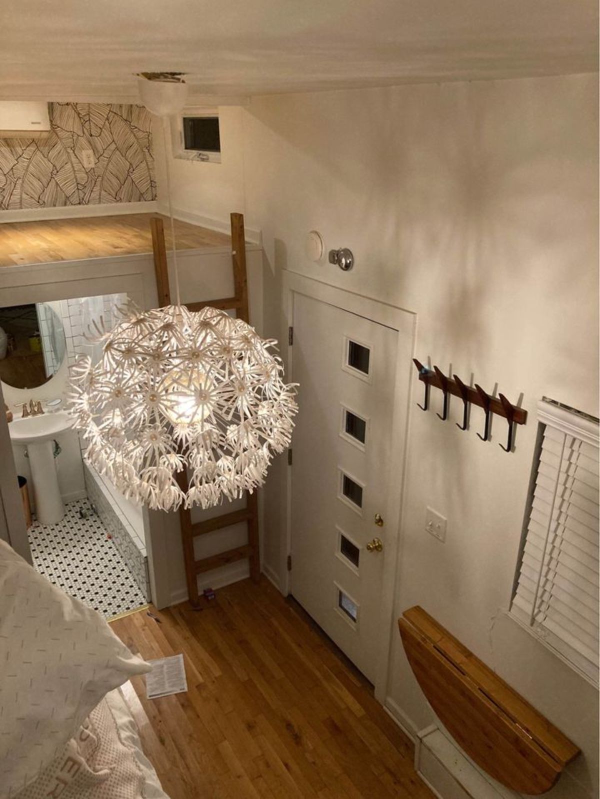 Fancy chandelier style light in living room of 24' Tiny Home