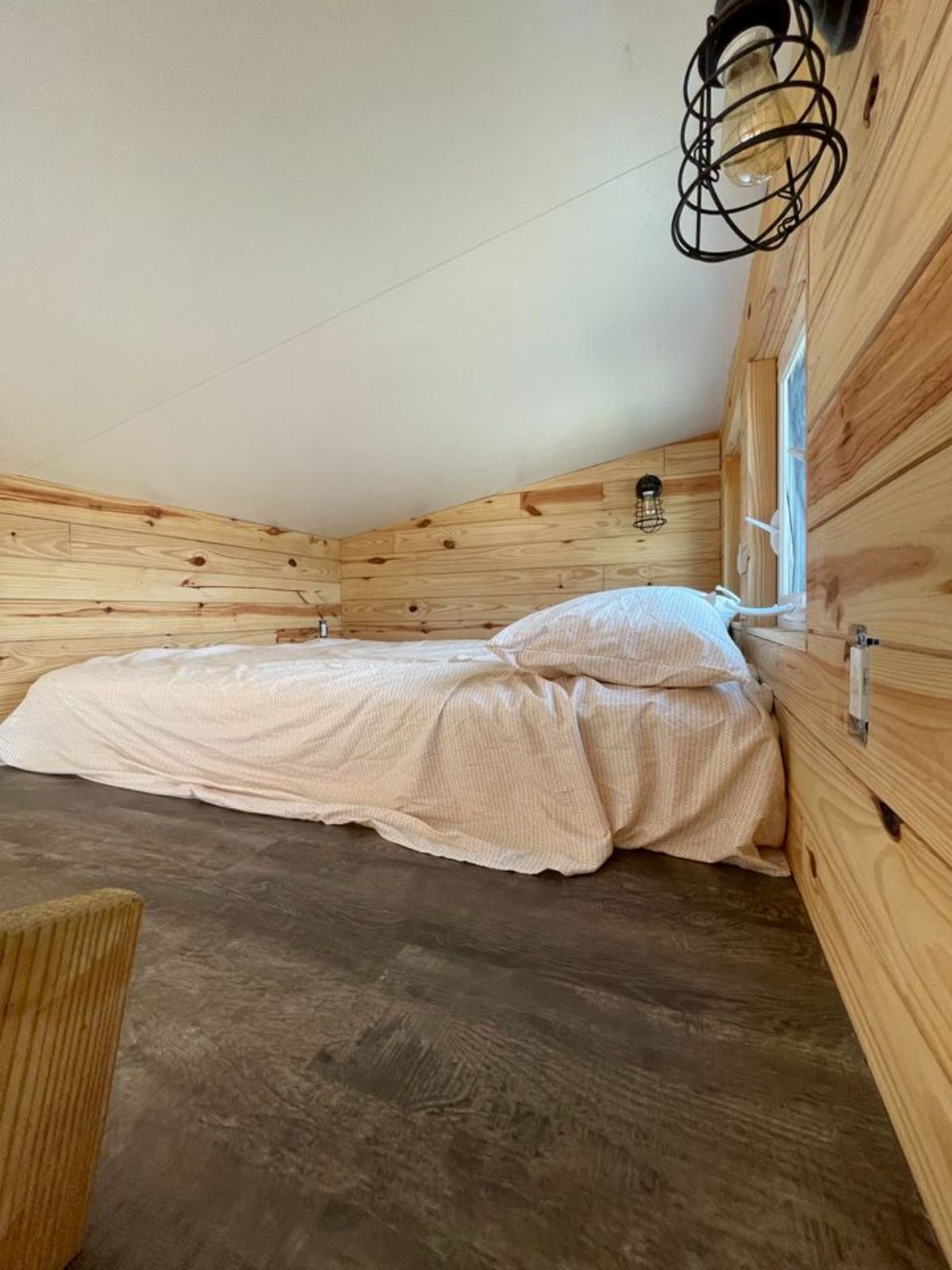 Master loft of 24’ Tiny House on Wheels has a queen sized bed.