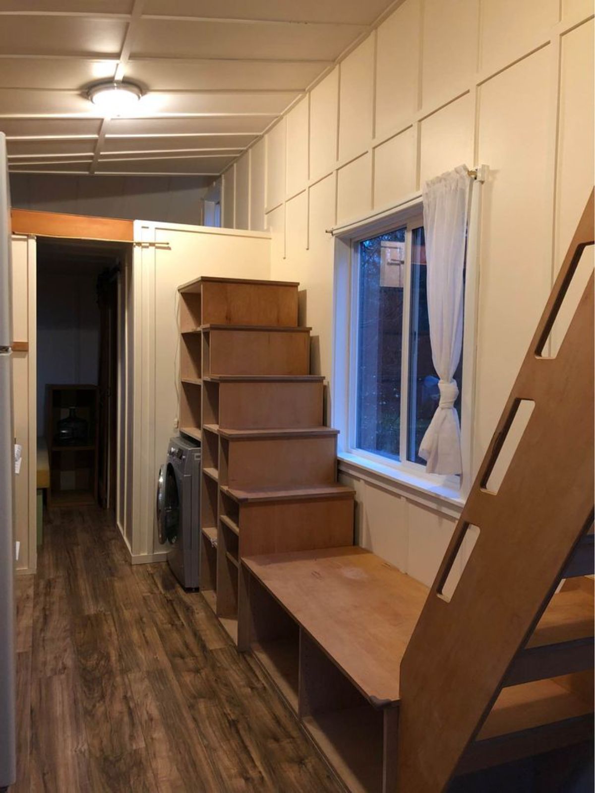Stairs towards both the lofts of 26' Tiny Home