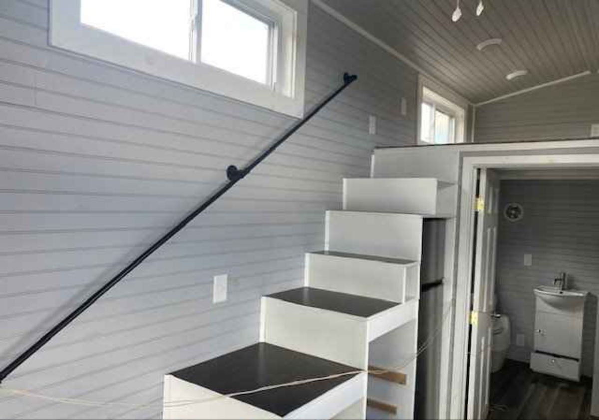 Stairs towards the main bedroom of 28' Tiny Home on Wheels