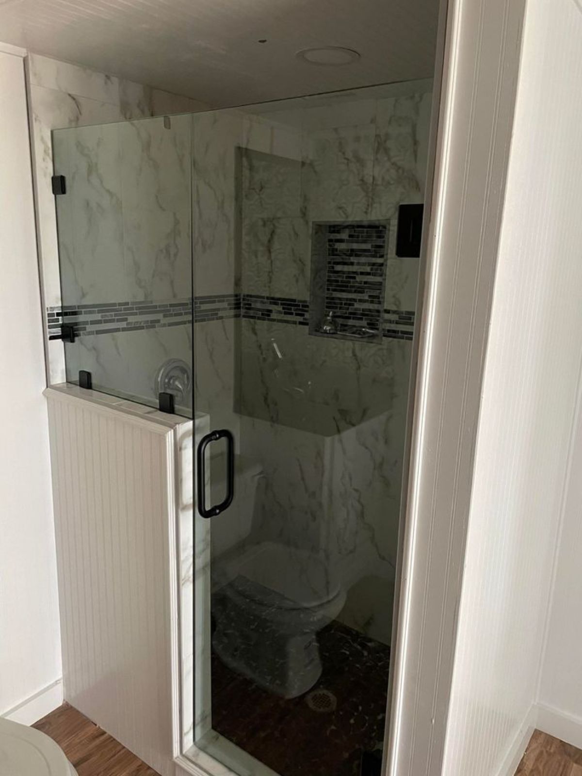 Shower area of 29' Long Luxury Tiny Home On Wheels