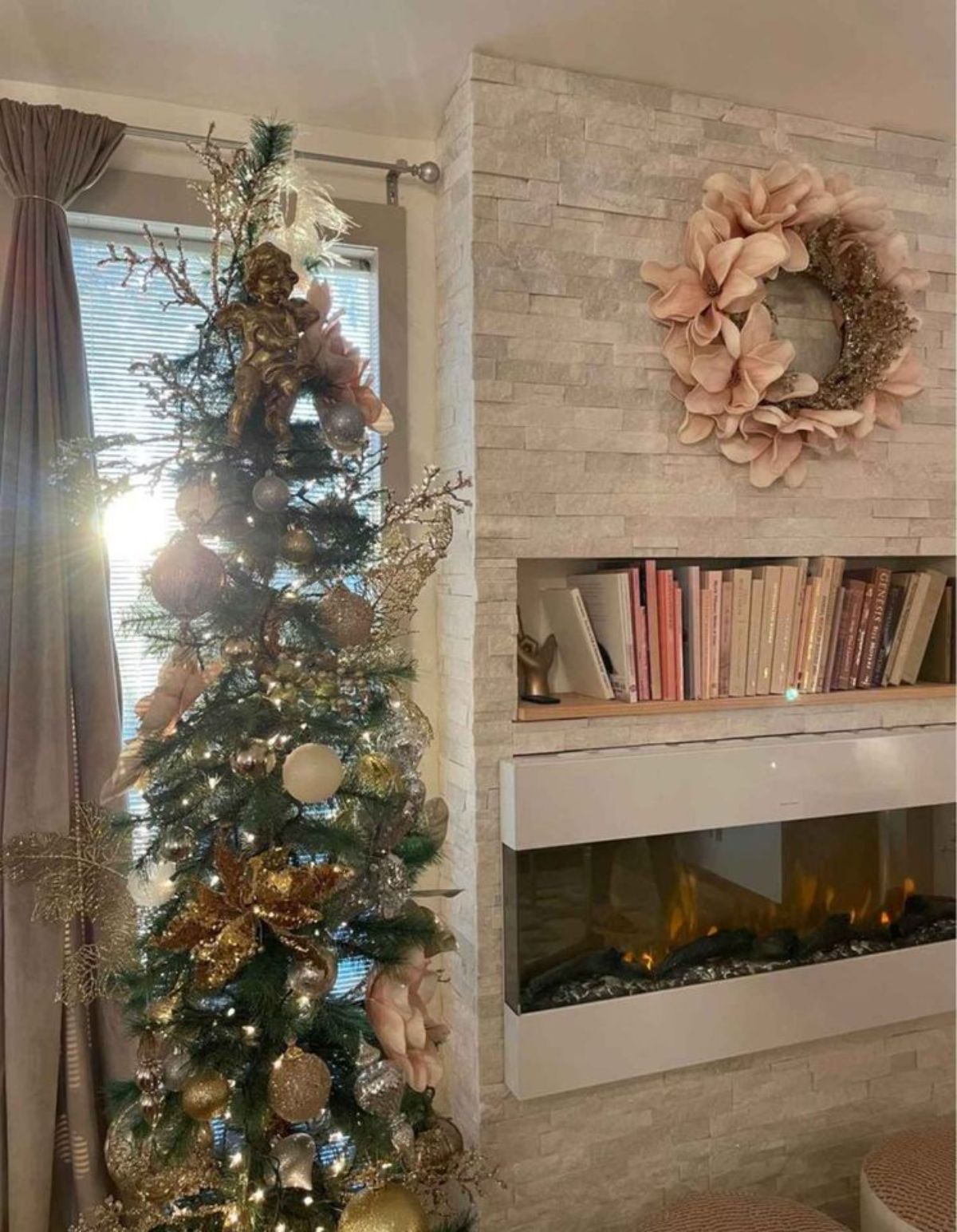Stunning stone made wall book storage  and decorated tree makes this house more elegant and beautiful