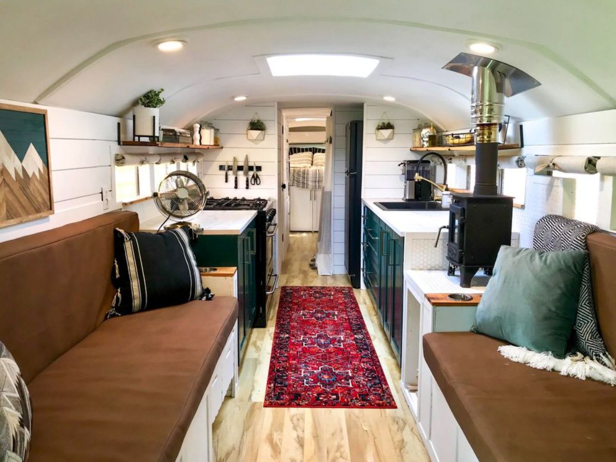 Living area of 37’ Converted School Bus has 2 couches