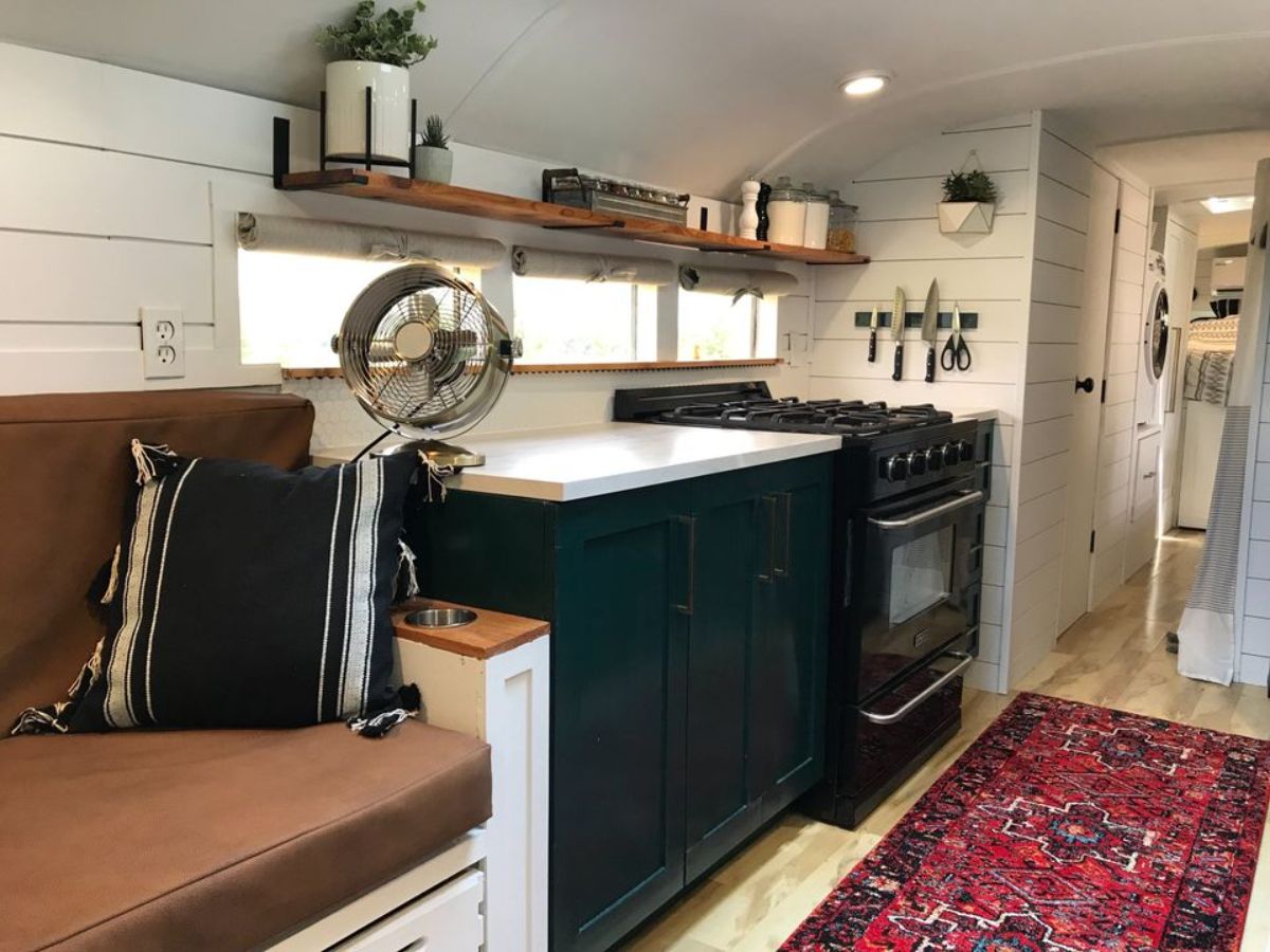Propane gas burner and counter top with storage in kitchen of 37’ Converted School Bus
