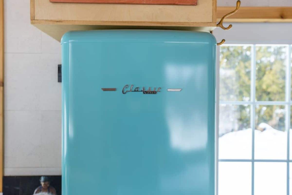 Refrigerator in the kitchen of Custom Tiny Home on wheels