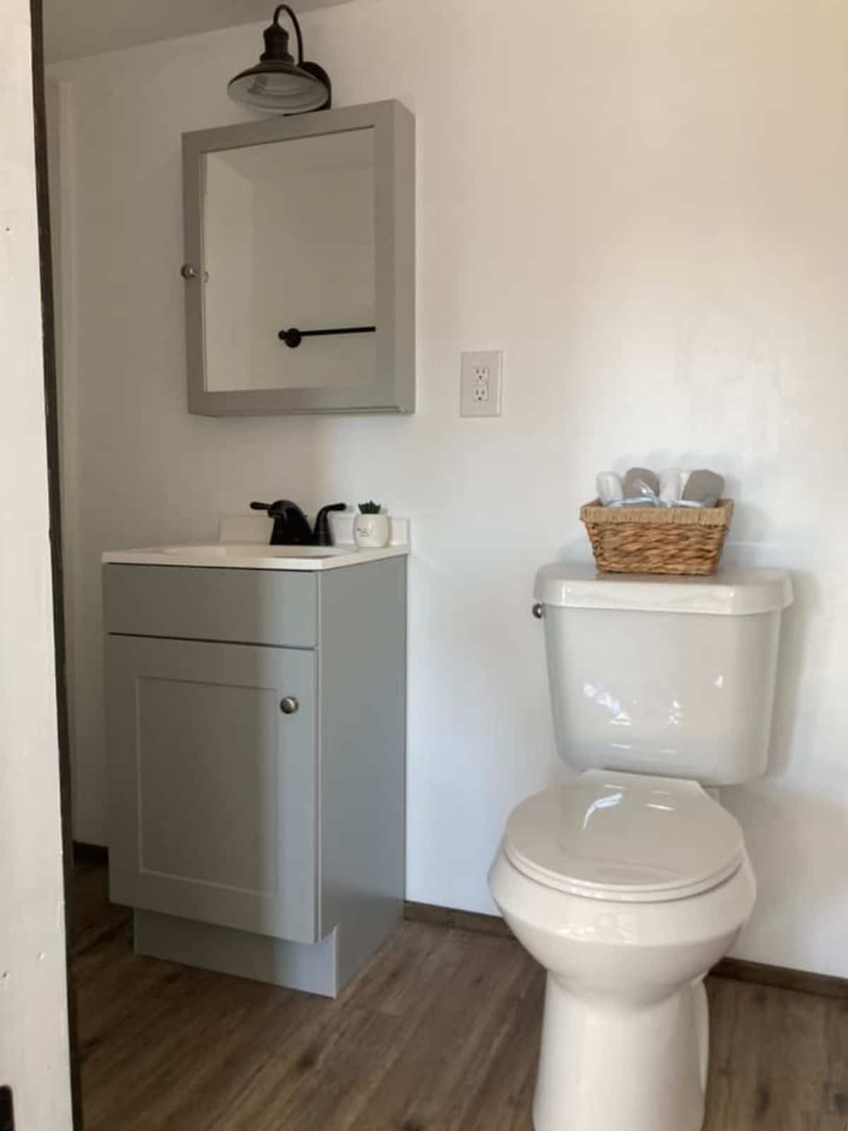 Toilet and sink plus storage for toiletries