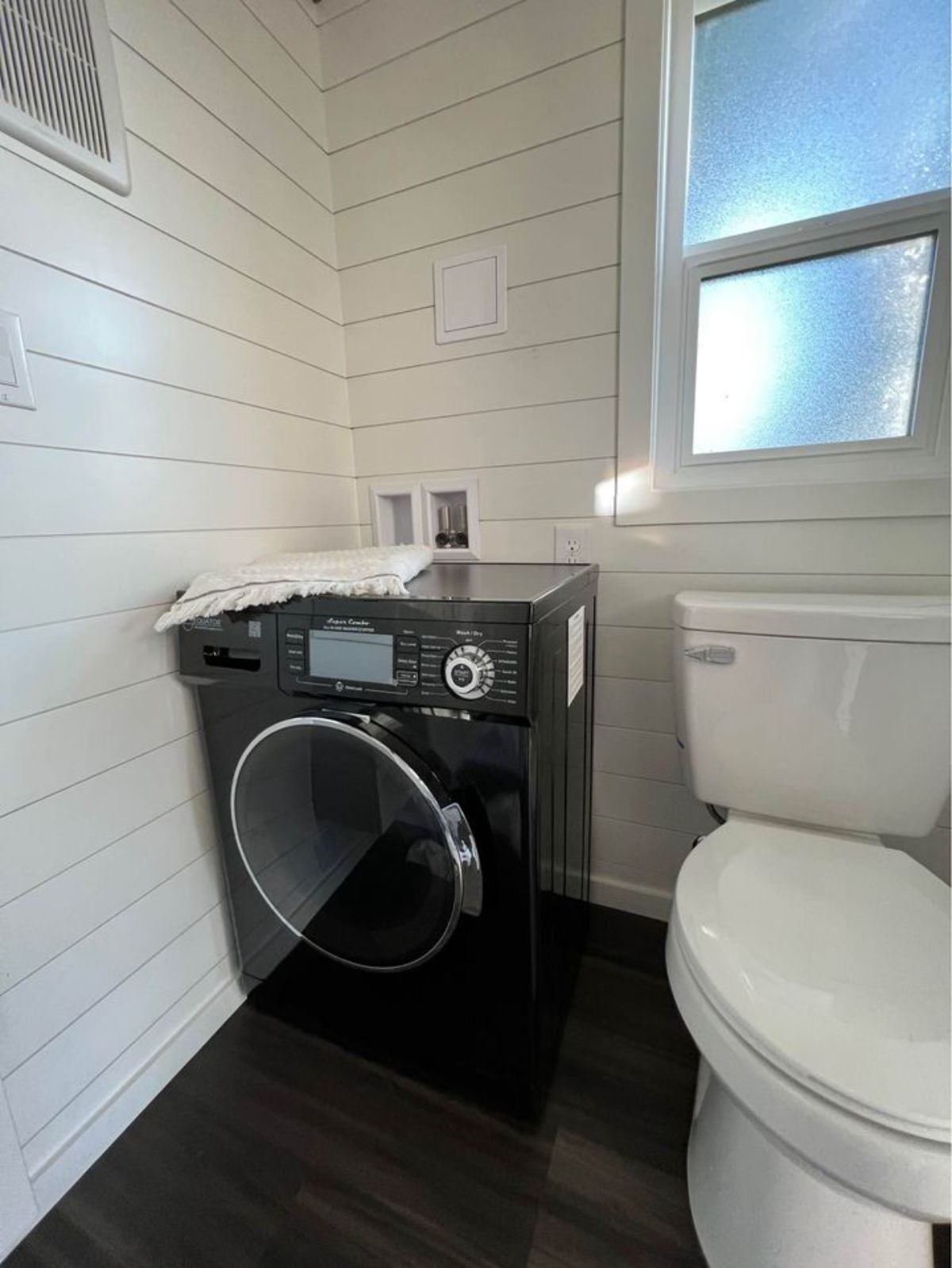 Toilet and washing machine of Modern Tiny Home on Wheels
