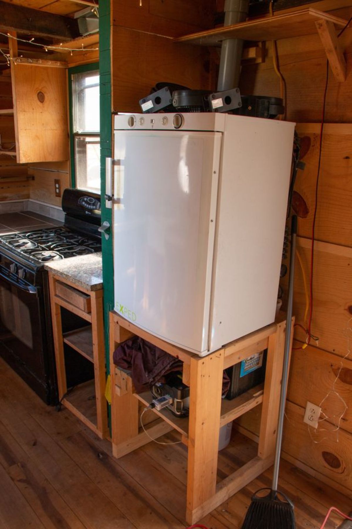 Small refrigerator in the kitchen of Rustic 22' Trailer
