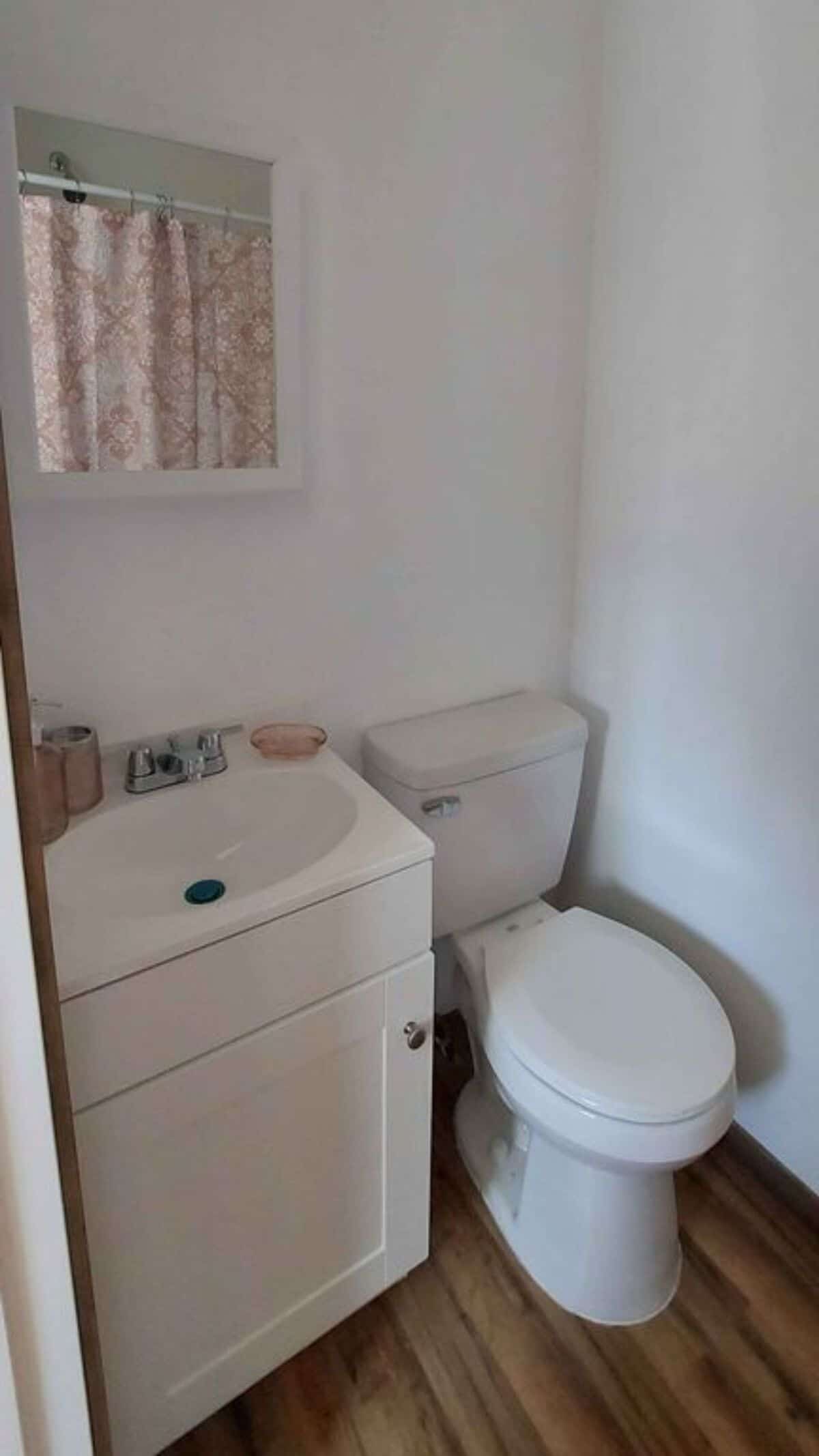 Sink with vanity and toilet area of 20' Tiny House