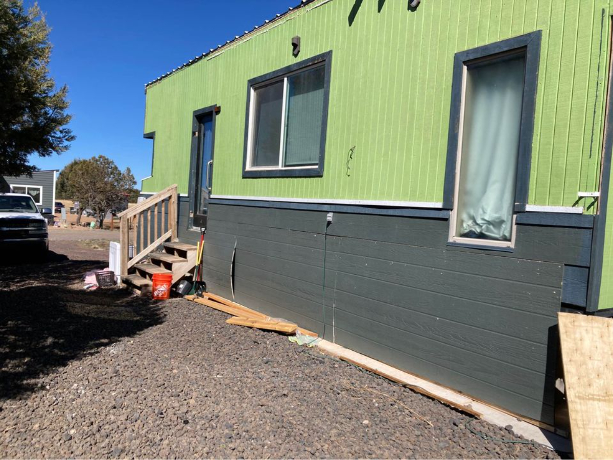 Exterior of 30' Budget-Friendly Tiny House is green in colour