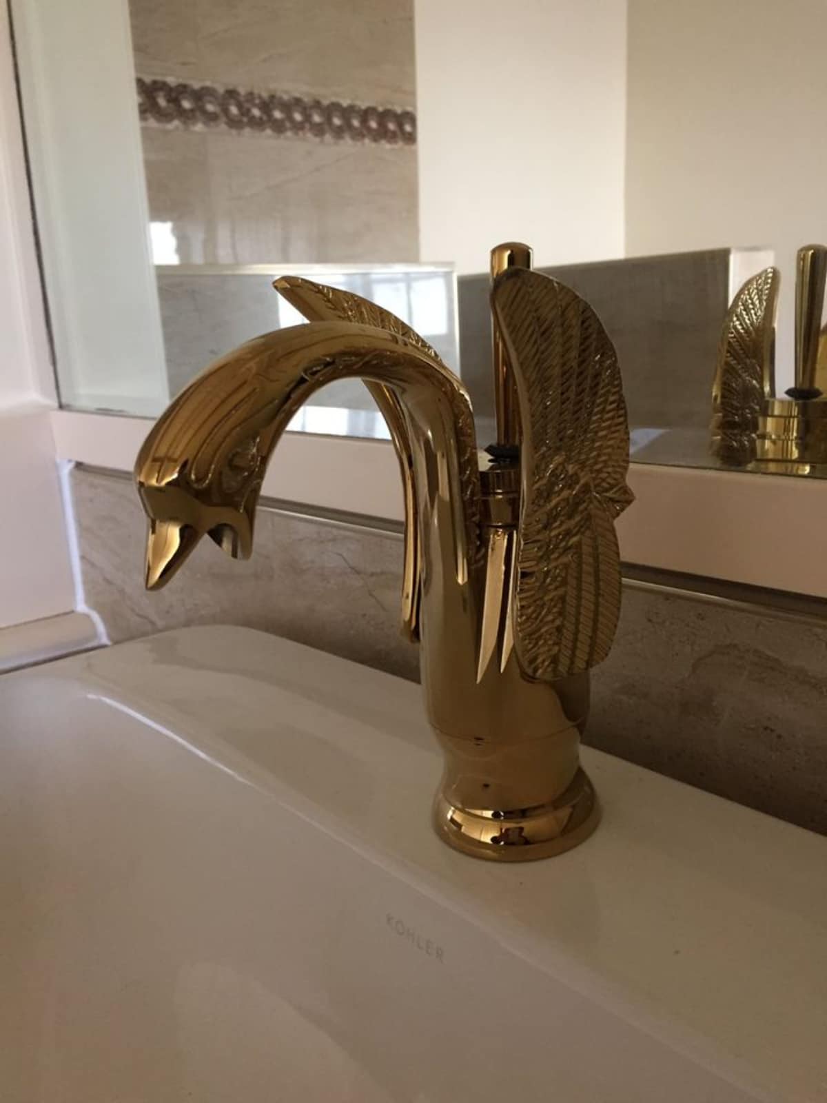 Golden faucet on sink of Custom 48’ Artistic Tiny House
