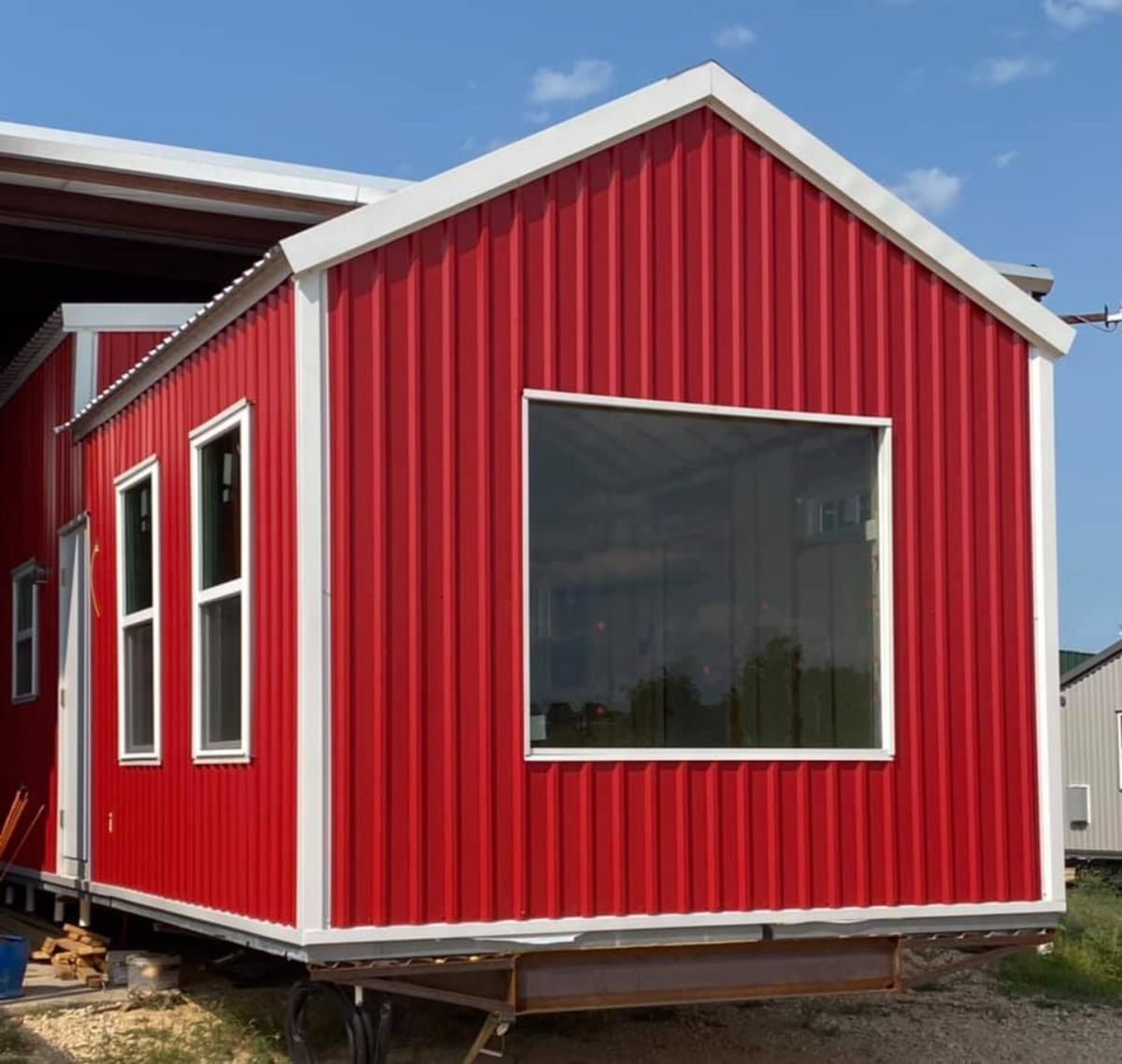 Gorgeous 40' Tiny House with red color exterior from outside
