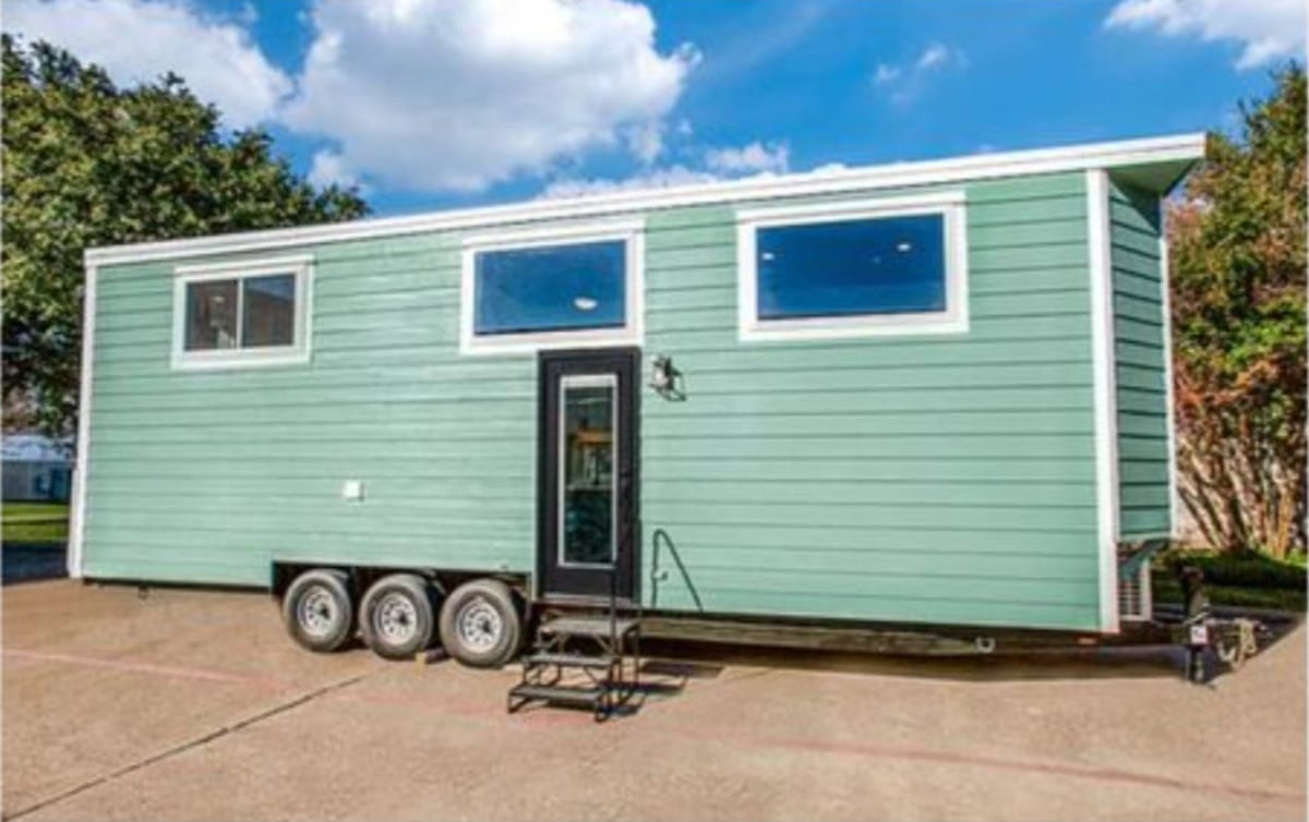 Subtle green exterior of Stunning 2 Bedroom Tiny House