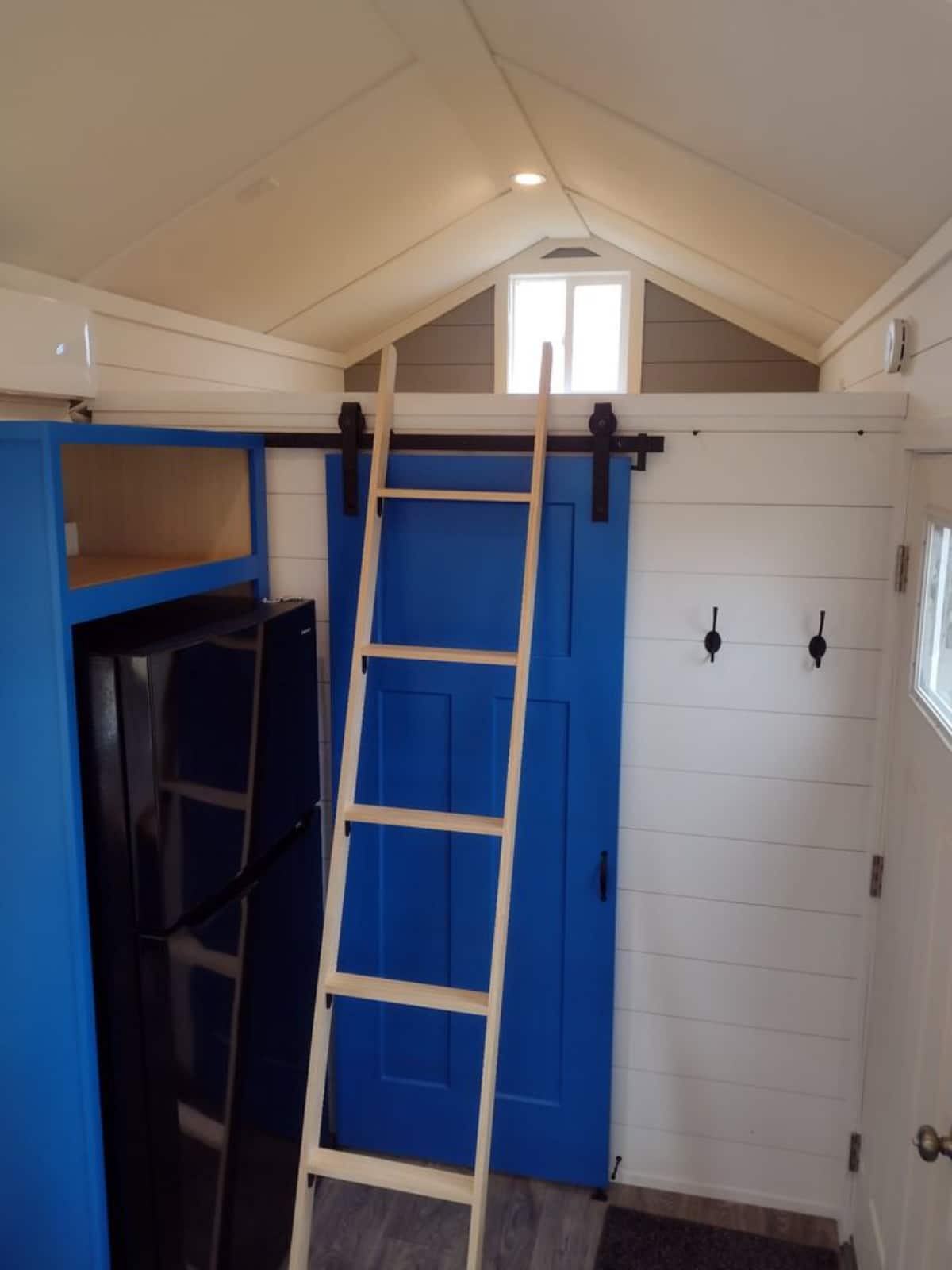 Loft 1 above the toilet is accessible through ladder