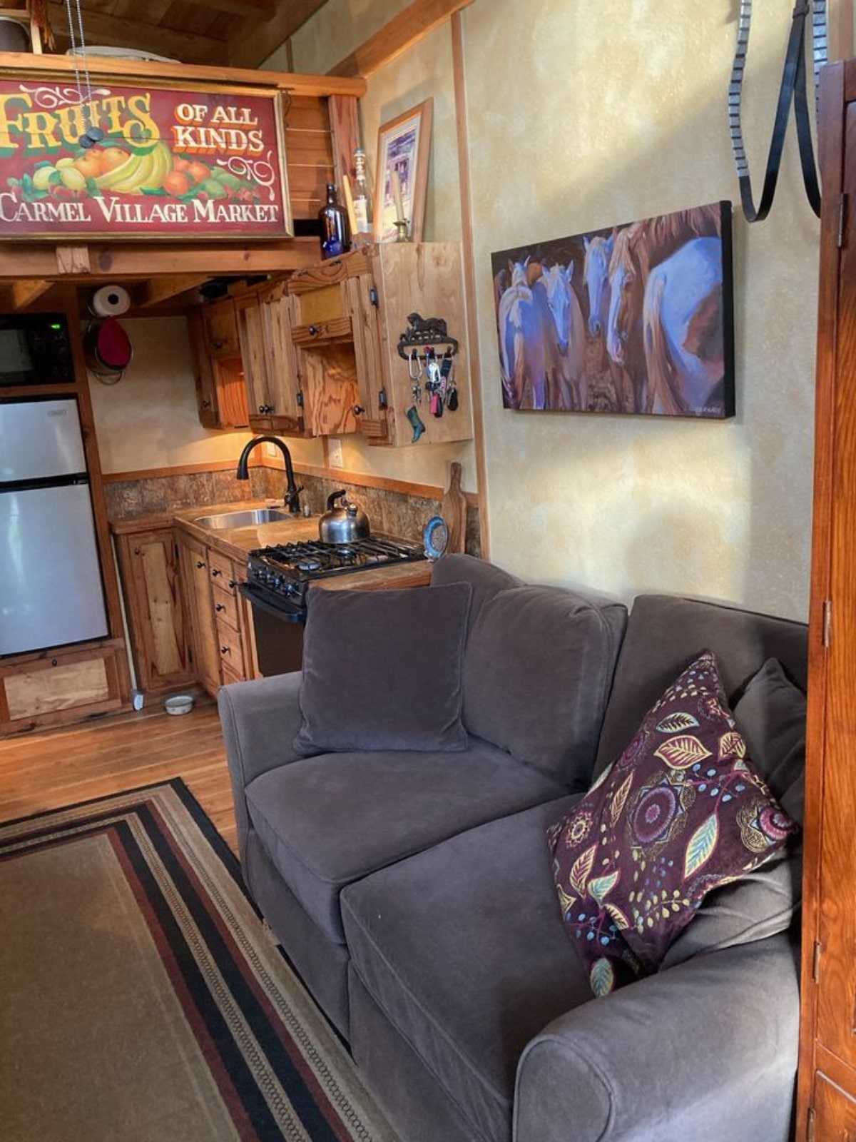 Living area of 270 sf Tiny Home has a couch