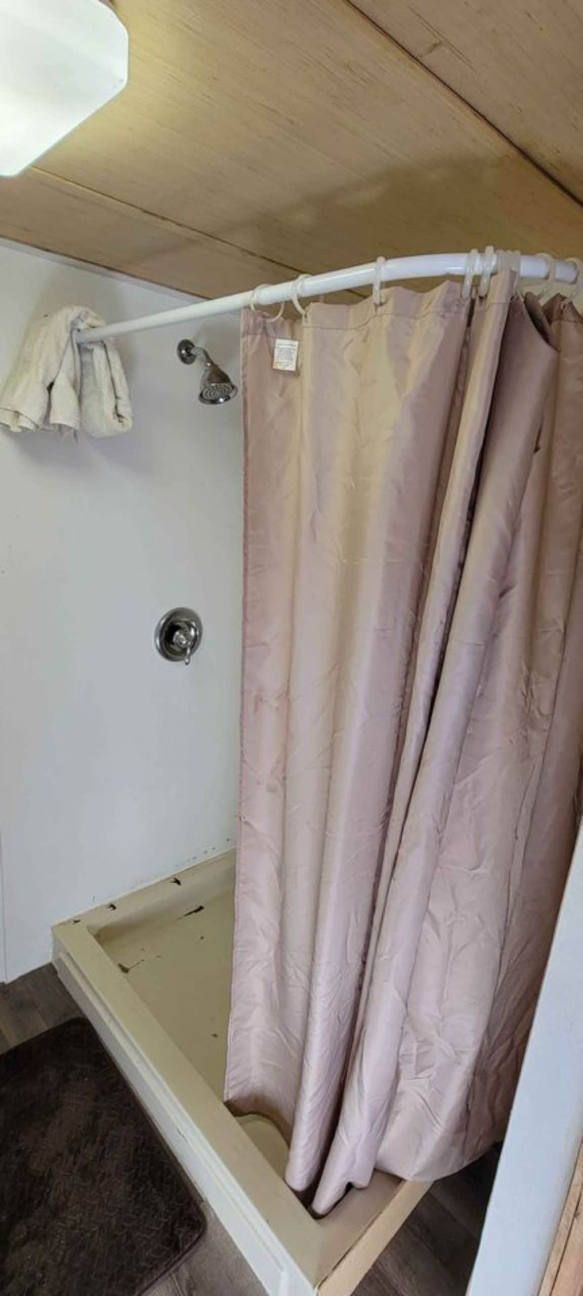 Separate shower area is there in bathroom of 28' Budget Friendly Tiny House