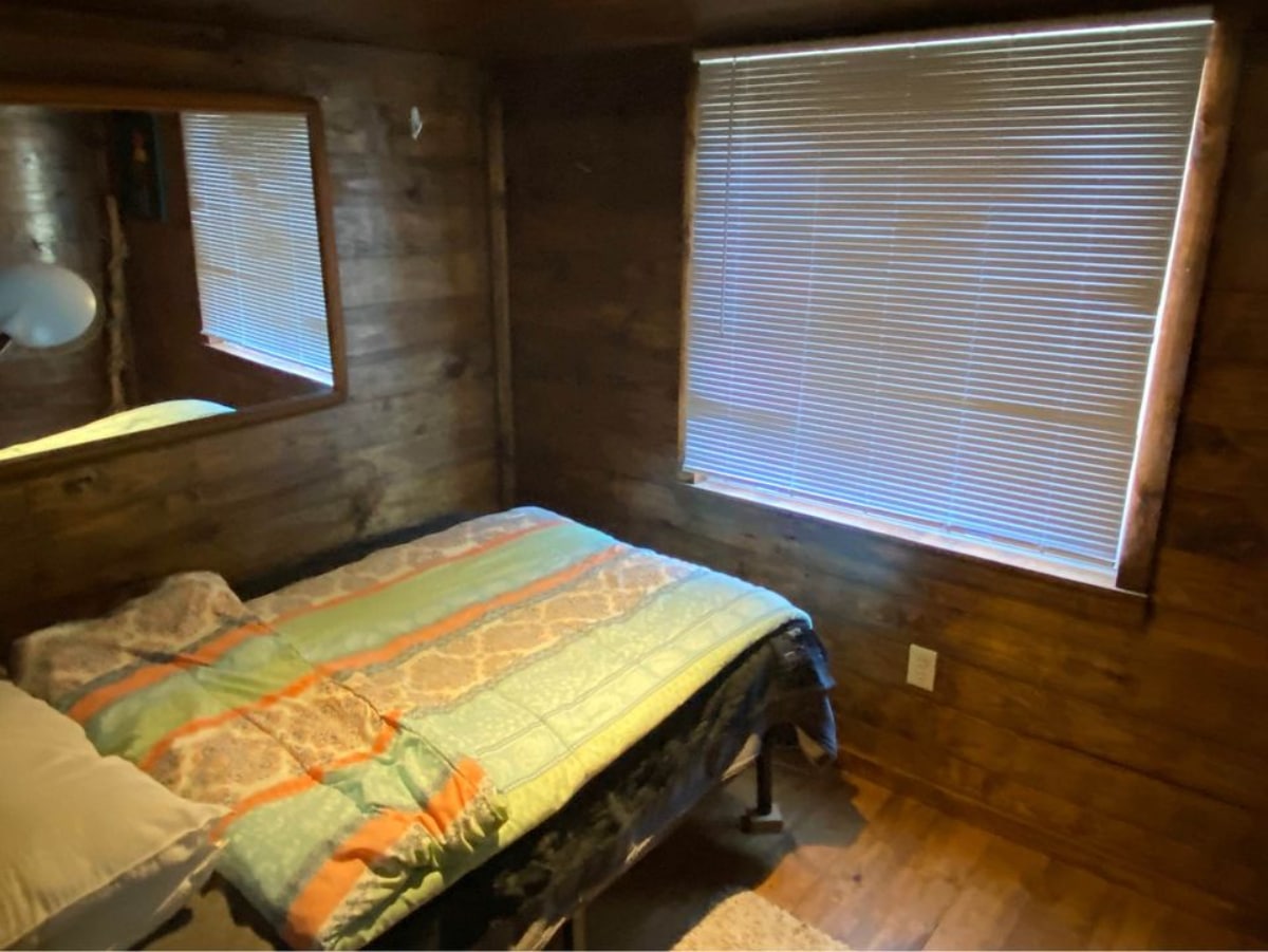 Main bedroom of 36' Tiny House has a queen bed and still ample space