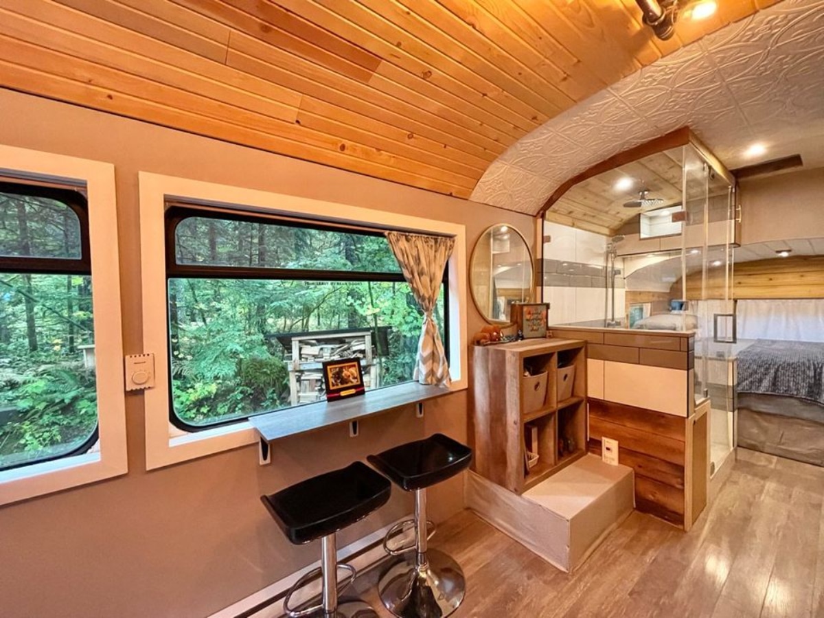 Dinning area and storage area of 40' School Bus Converted Tiny House