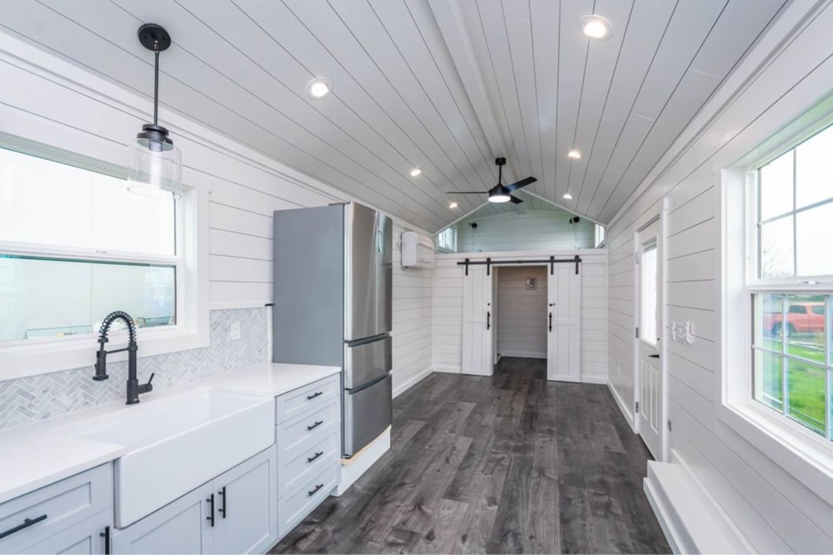 Spacious living area of Stunning 400 sf Tiny Home can accommodate a couch, television set and a wall unit