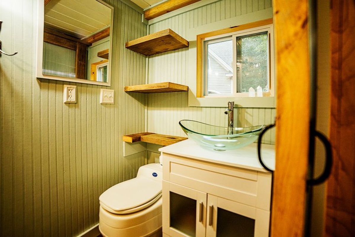 Sink with vanity and mirror of 19’ Custom Built Tiny House