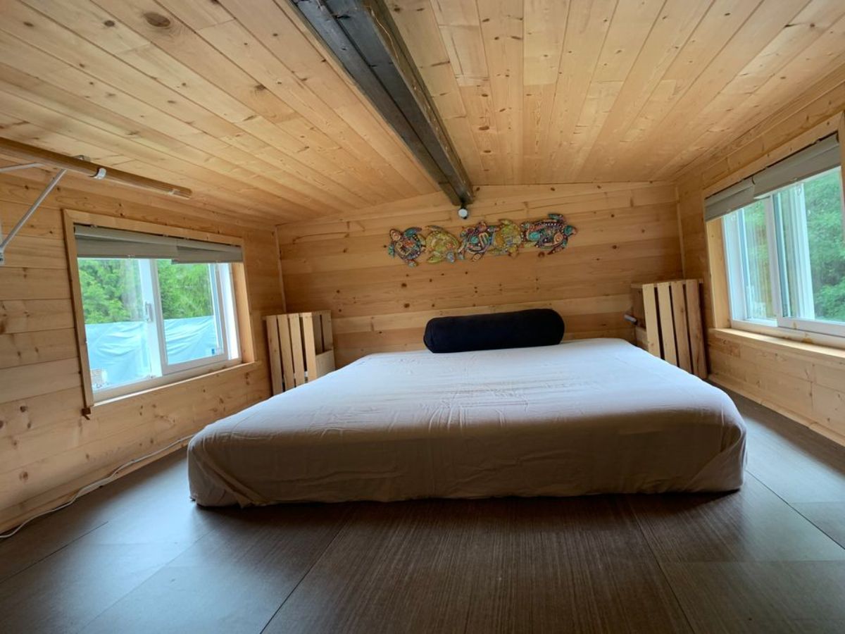 Loft 1 is above the bathroom and accessible through ladder and it has a queen size mattress