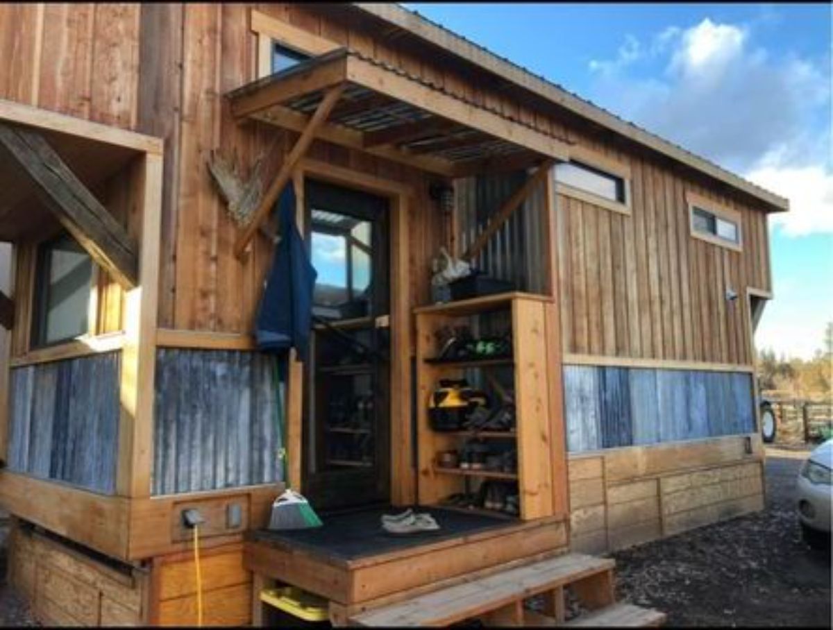 Front main entrance of 24’ Rustic Tiny House On Wheels