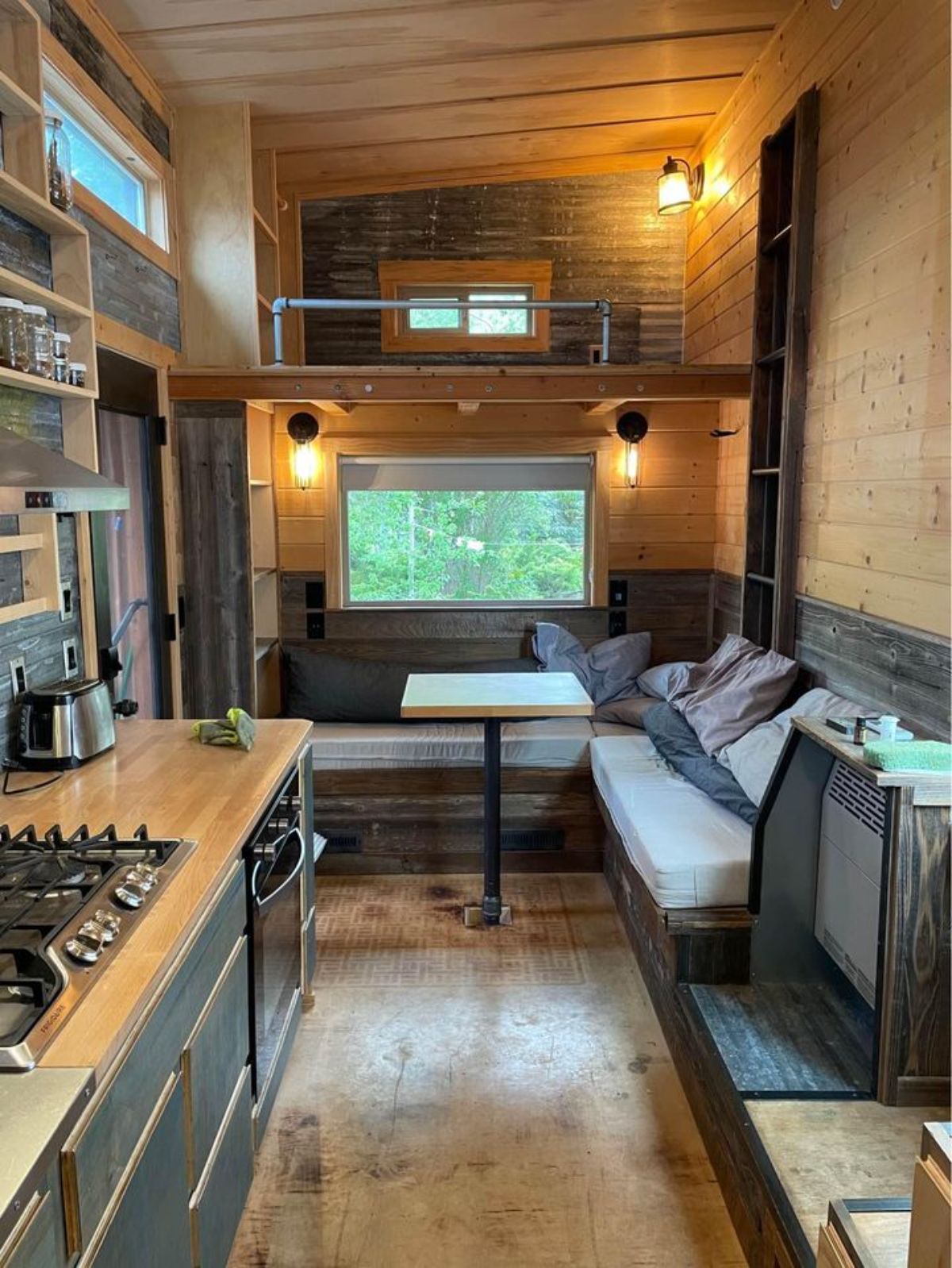 Classic wooden interior of 24’ Rustic Tiny House On Wheels