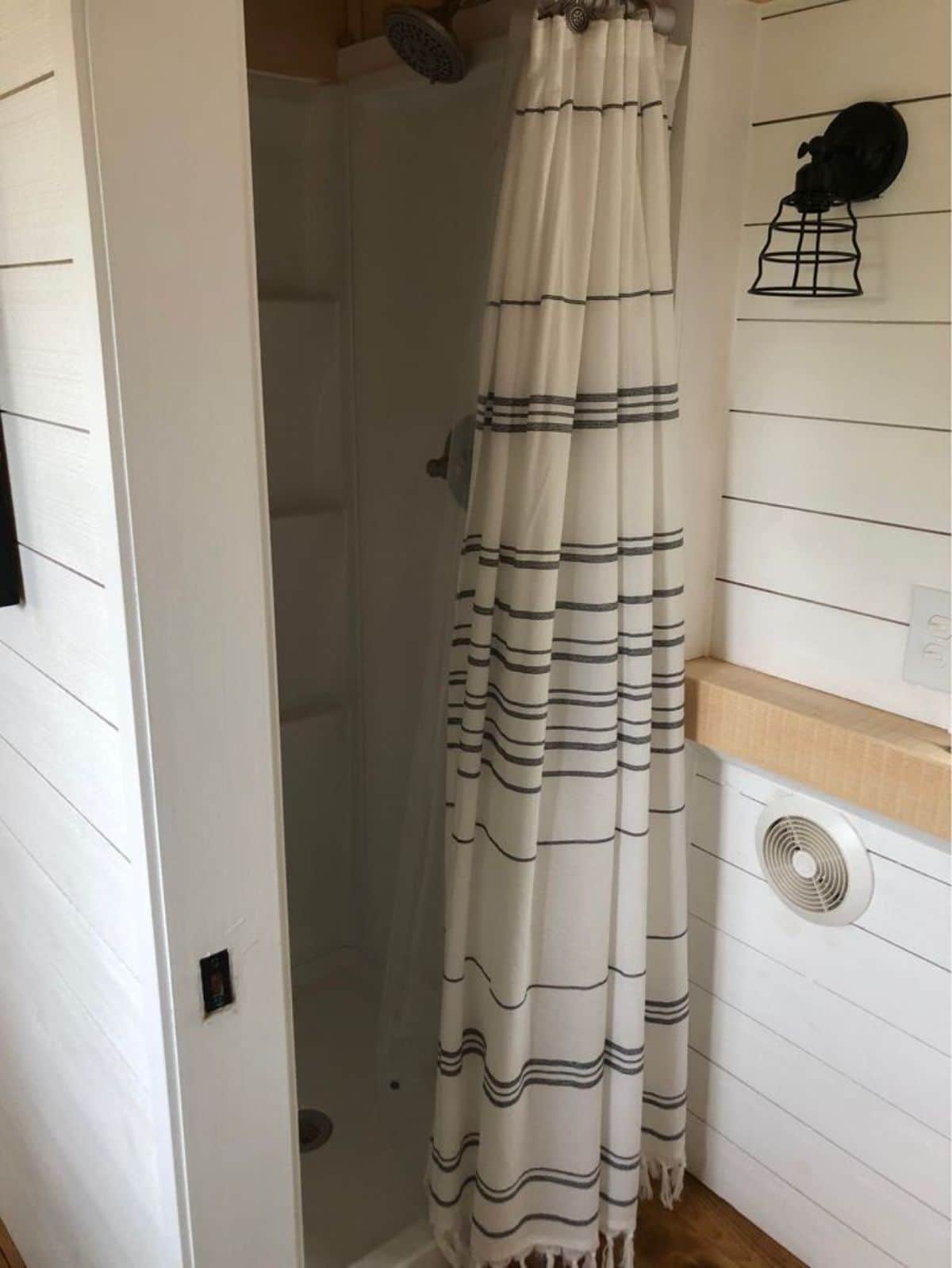 Shower area in bathroom of 26’ Timber Framed Tiny House