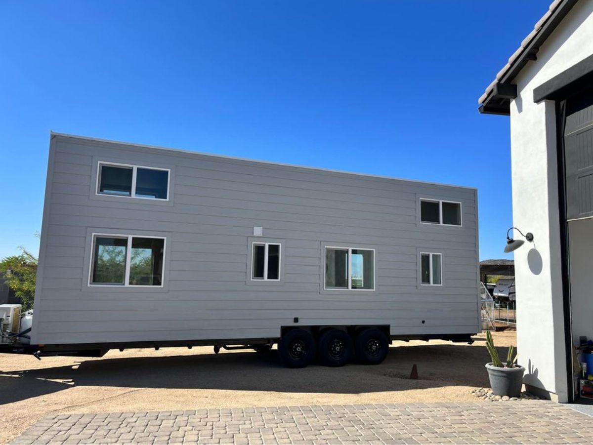 Backside of 30’ Modern Tiny House on Wheels from outside