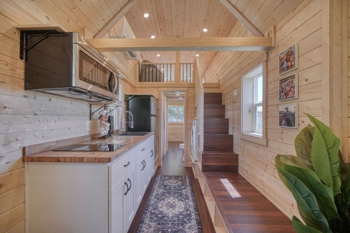 Opposite to kitchen there is a stairs towards the loft bedroom of 2 Bedroom Tiny House