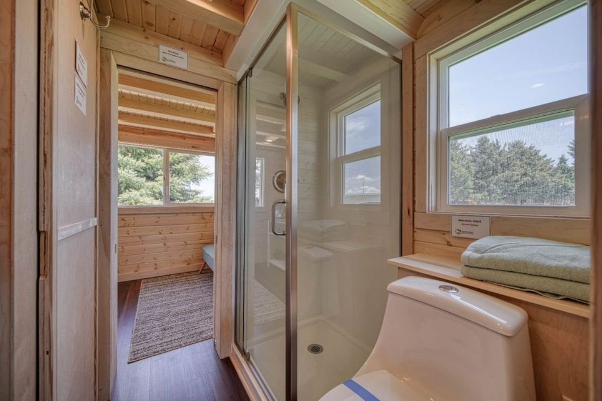 Glass shower area in bathroom of 2 Bedroom Tiny House
