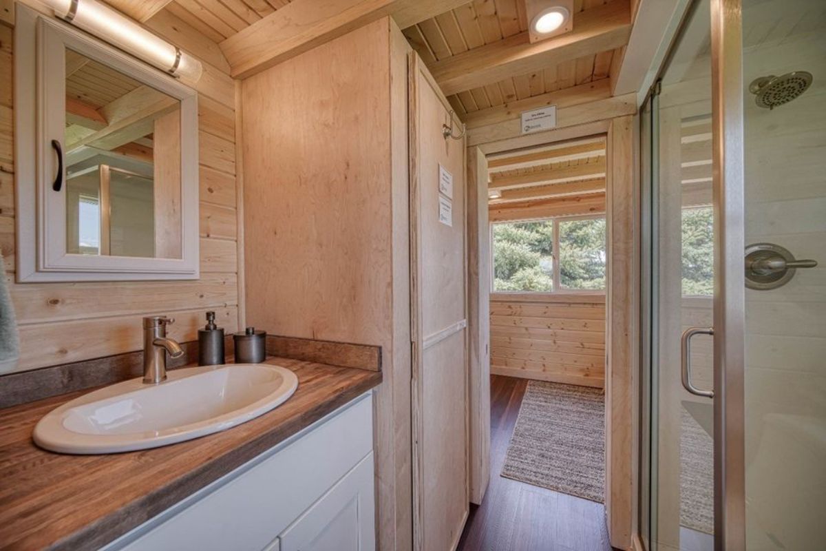 Bathroom of 2 Bedroom Tiny House has  a sink with vanity and a mirror