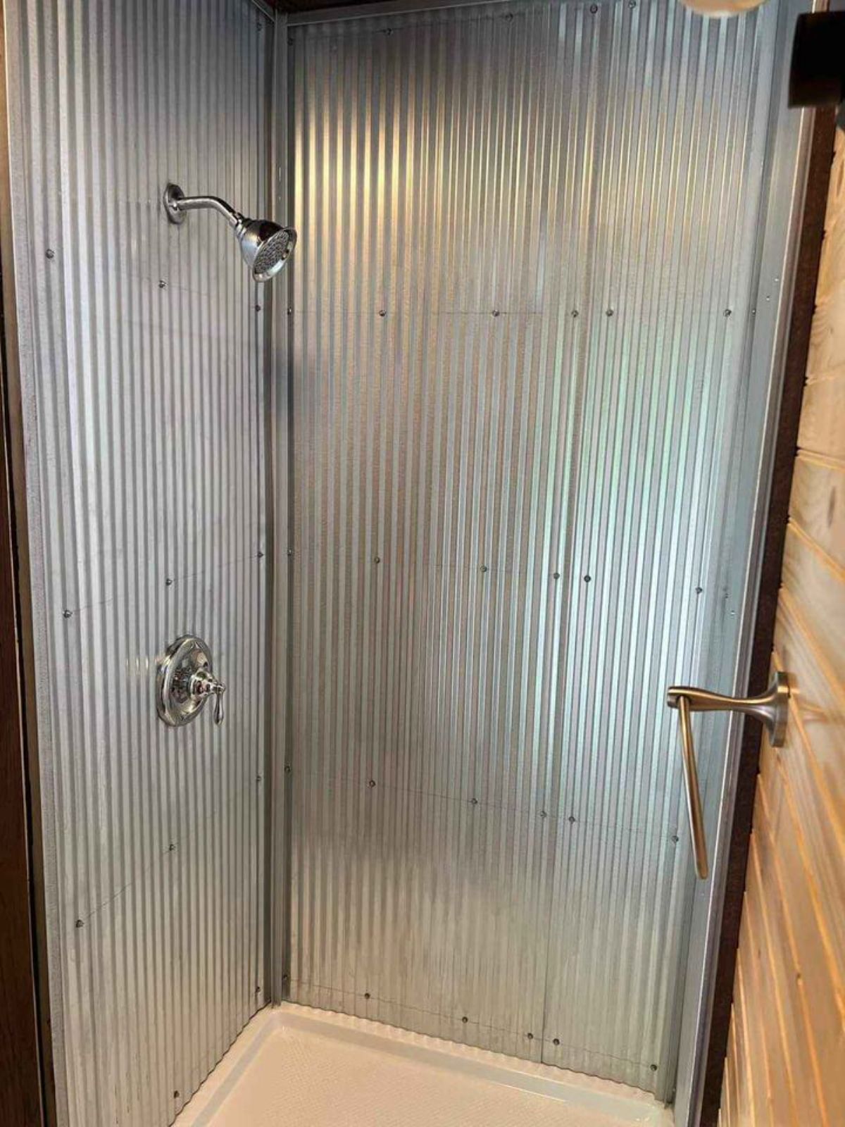 Separate shower area in bathroom of Spacious Tiny House