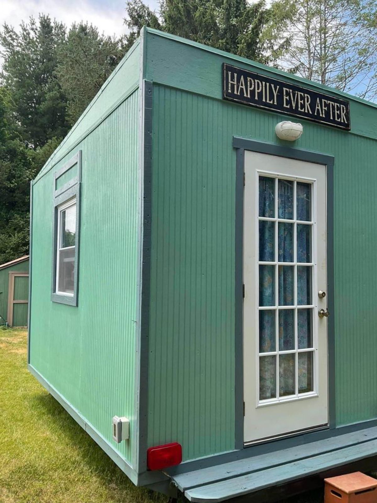 Green color exterior walls of 12’ Micro Tiny House
