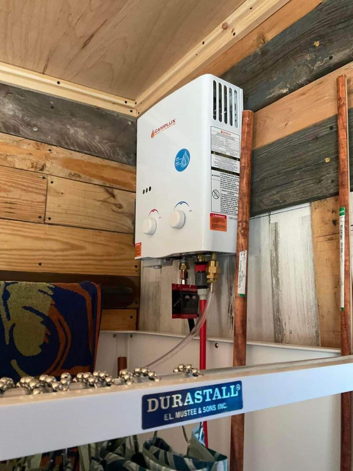 Water heater in bathroom of 12’ Micro Tiny House