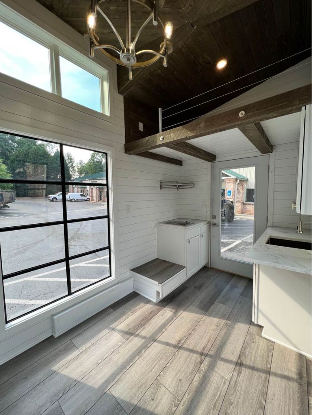 Kitchen area of 16’ Modern Tiny House is divided into 2 parts opposite to each other