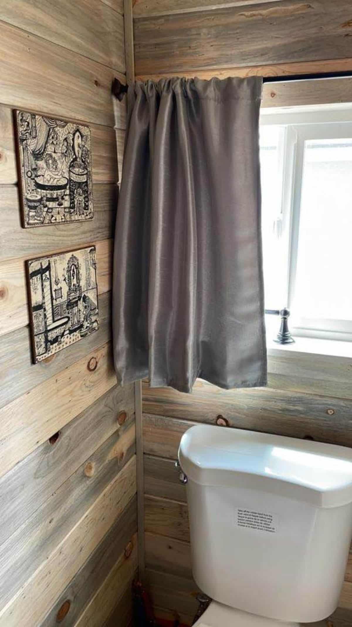 Bathroom of 20’ Tiny Househas a standard toilet