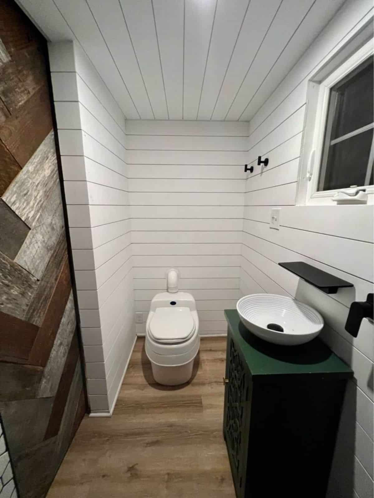 Sink with vanity and toilet of 22’ Luxury Tiny House
