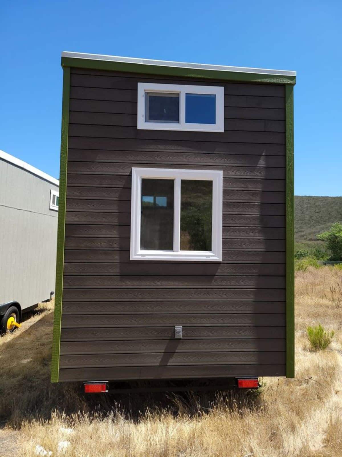 Side view of 24’ Two Bedroom Tiny House from outside
